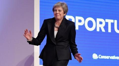 Theresa May dancing