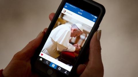 Mobile with Pope Francis' Instagram account showing