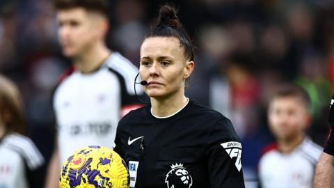 Referee Rebecca Welch walks out with the match ball before Fulham v Burnley at Craven Cottage