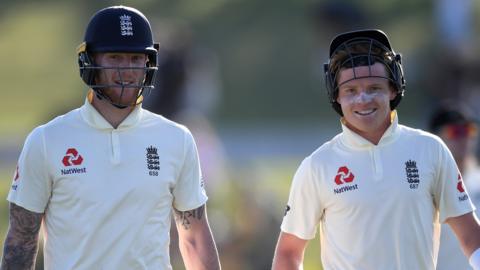 England batsmen Ben Stokes (left) and Ollie Pope (right) smile as they walk off after day one of the first Test against New Zealand