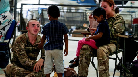 British Army looking after children at Wadi Seidna Air Base