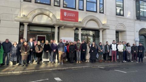 Public servants standing outside Broad Street building