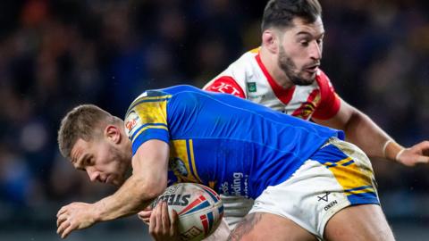 Catalans Dragons captain Ben Garcia tackles Jack Walker