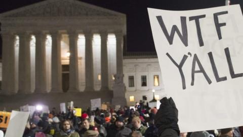 Demonstrators protest against President Trump outside the US Supreme Court