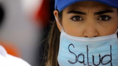 A demonstrator wears a mask that reads "Health" as she attends a rally called by health care workers and opposition activists against Venezuela"s President Nicolas Maduro in Caracas, Venezuela May 22, 2017