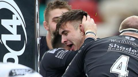 Taine Basham celebrates his try for Dragons