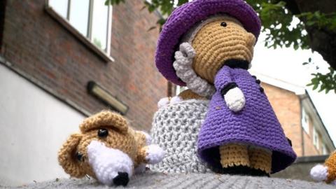 Crochet queen and corgis post box hat