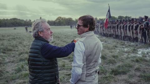 Ridley Scott and Joaquin Phoenix on the set of Napoleon