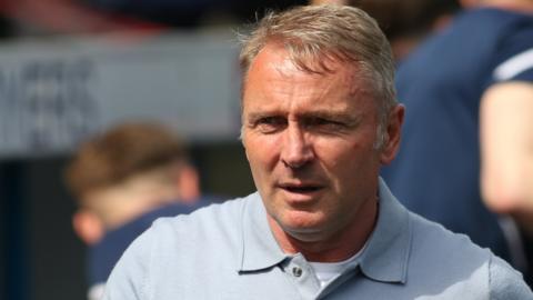 Paul Simpson smiles after Carlisle's play-off semi-final win over Bradford