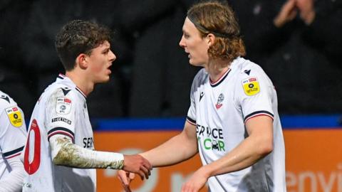 Jon Dadi Bodvarsson (right) is congratulated after scoring Bolton's winner against Portsmouth in the EFL Trophy quarter-finals