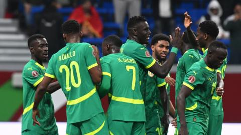 Senegal celebrate a goal