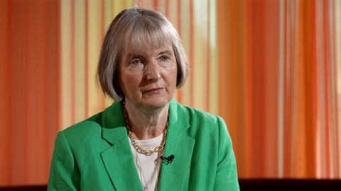 Harriet Harman head and shoulders shot, wearing a green blazer against an orange backdrop as she speaks to Sima Kotecha during a 鶹ҳ interview