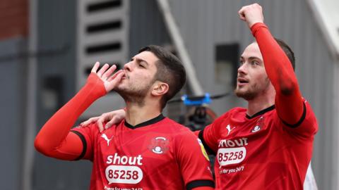 Leyton Orient players celebrate