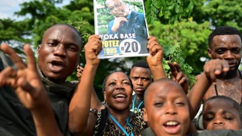 Supporters of the winner of December 30 presidential election, Felix Tshisekedi, hold up a poster of him