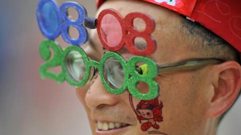 Man wearing novelty glasses at the Beijing Olympics opening ceremony (Aug 2008)