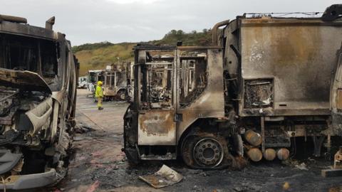 Burnt out refuse lorries