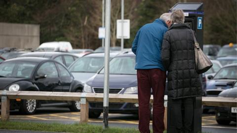 A couple at a car parking machine