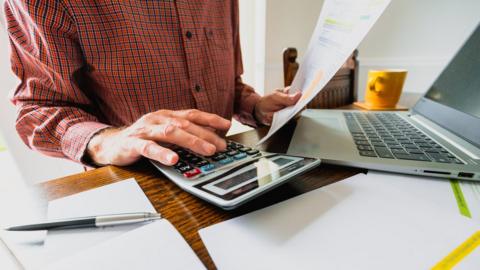 Desk view of paying bills