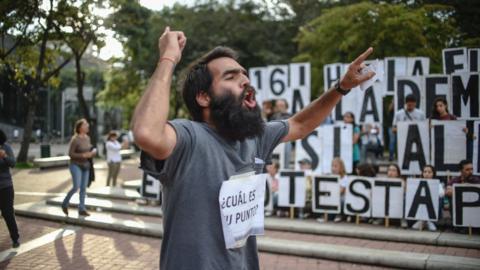 man protests against maduro