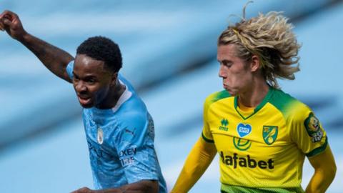 Manchester City's Raheem Sterling and Todd Cantwell of Norwich