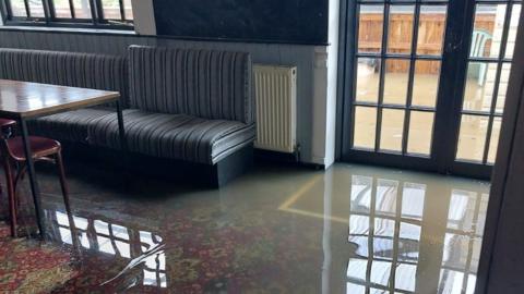 Flooded ground floor of pub
