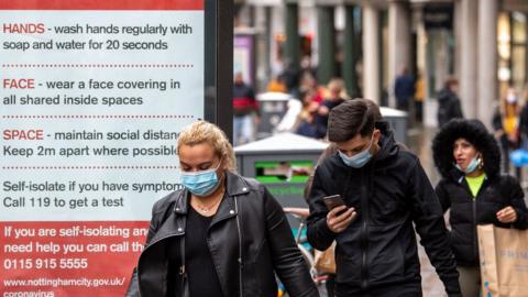 Shoppers wearing face masks