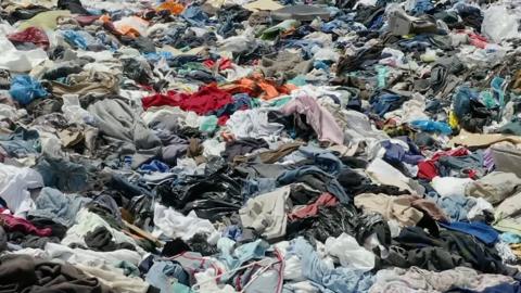 Abandoned clothes in landfill