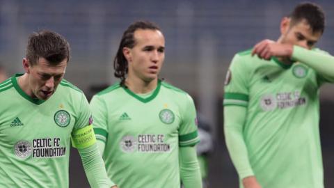 Celtic's Callum McGregor, Diego Laxalt and Nir Bitton are left disappointed in Milan