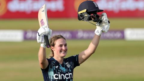 England batter Emma Lamb celebrates hitting a century