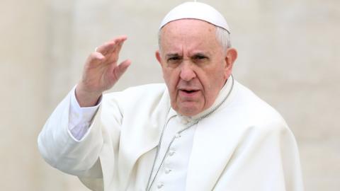 Pope Francis waves to the faithful