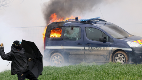 A gendamerie vehicle burns during a demonstration called by Bassines non merci
