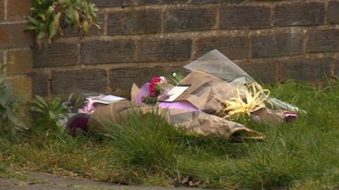Bouquets of flowers left outside house