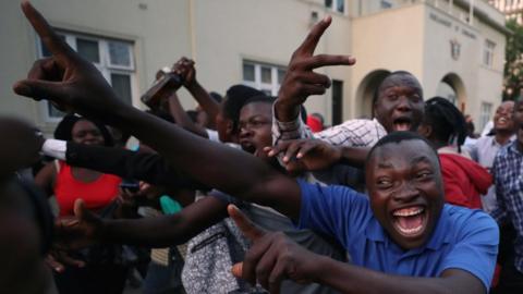 People celebrating in Harare, Zimbabwe