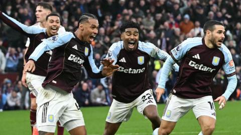 Emi Buendia and Villa team-mates celebrate his winner