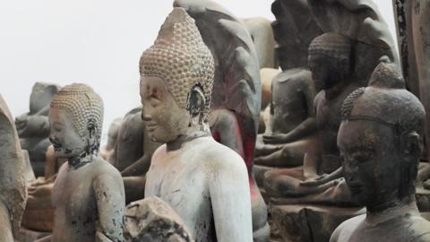 Statues placed in a warehouse near Angkor Wat for protection from looters