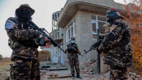 Taliban inspect the scene of an operation against the IS militants at an IS hideout in the outskirts of Kabul, Afghanistan, 18 November 2021.