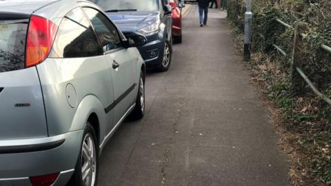 Cars parked on pavement