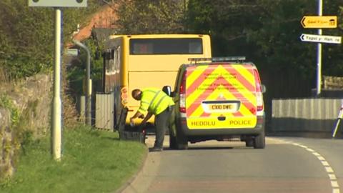 police outside Ysgol yr Hendre in Caernarfon where a girl was hit by a bus