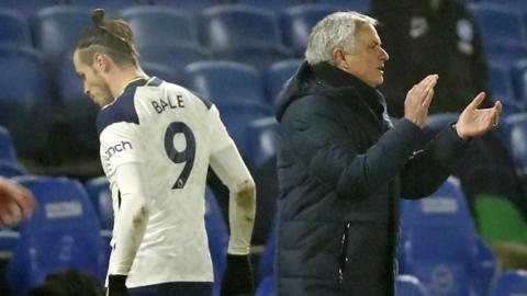 Gareth Bale walks past Jose Mourinho after being substituted during Tottenham's game with Brighton