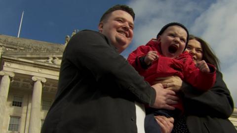 Dáithí MacGabhann with his parents who have campaigned for the law change