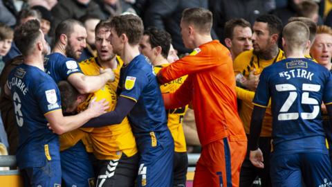 Newport and Mansfield players clash