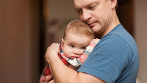 Man holding baby