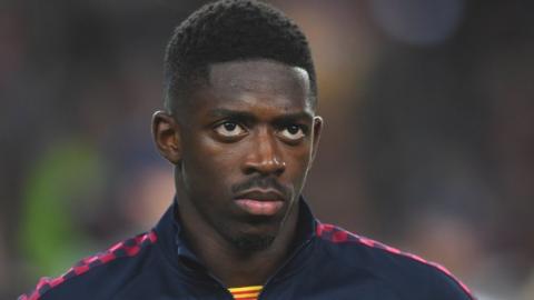 Barcelona winger Ousmane Dembele looks on