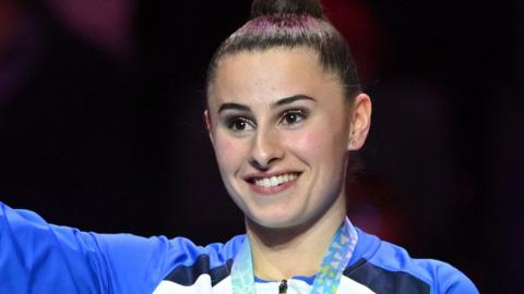 Louise Christie on the podium with her silver medal at the 2022 Commonwealth Games in Birmingham