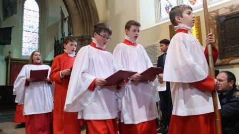 Choirboys walk through St Patrick's Cathedral during the thanksgiving service