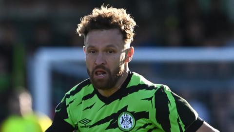 Matty Taylor running during a game for Forest Green