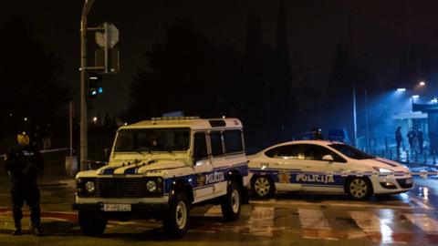 Police guard the entrance to the United States embassy building in Podgorica, Montenegro, February 22, 2018.