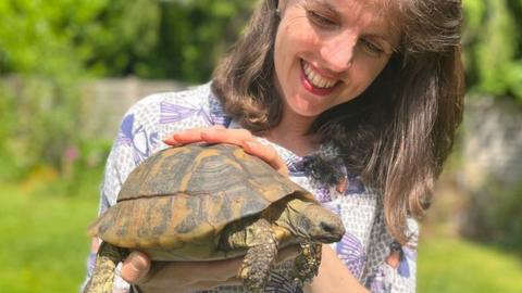 Lizzie Jeanes holding Twin the tortoise