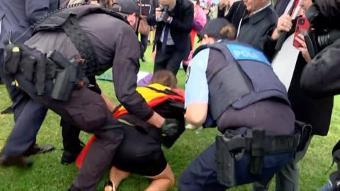 Senator Lidia Thorpe being manhandled outside parliament in Canberra