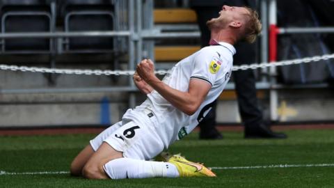 Harry Darling celebrates scoring Swansea's second goal